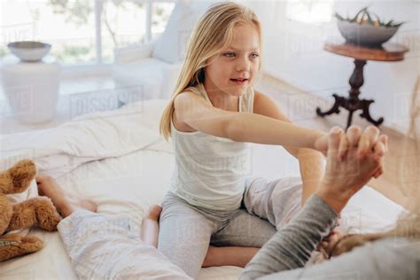 daddyanddaughter|Loving father and cute daughter playing in bed